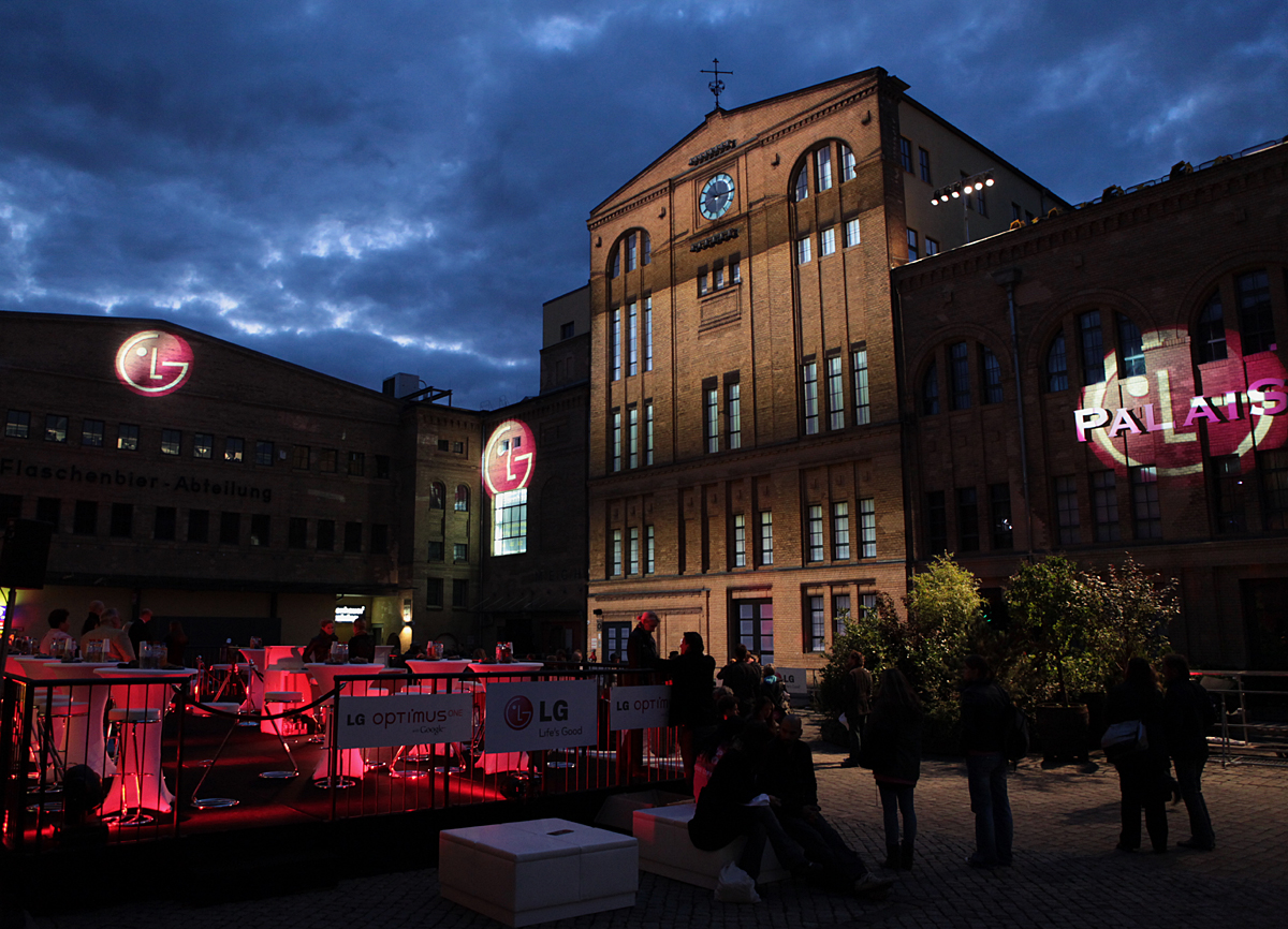 Three gigantic 3D LG logos projected onto the front wall of buildings in Kulturbrauerei, the cultural heart of Berlin.