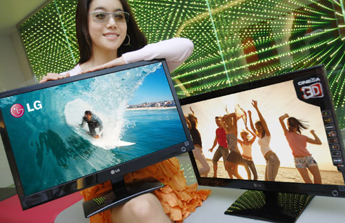 LG Cinema 3D Monitor_With a Model (1).jpg A model wearing 3D glasses presents two LG Cinema 3D Monitors.