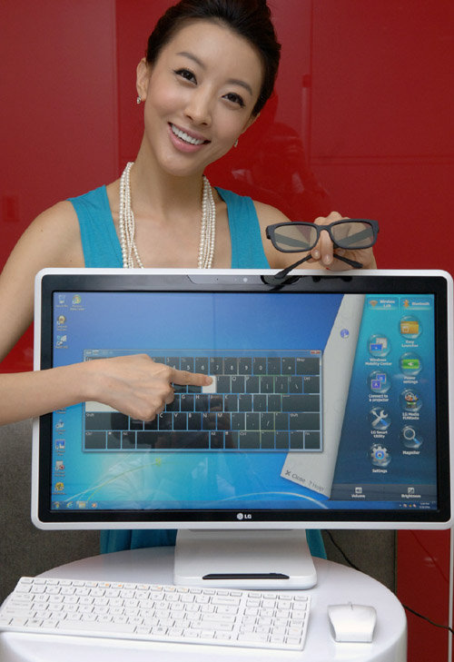 A model is posing with the LG all-in-one PC model V3001.