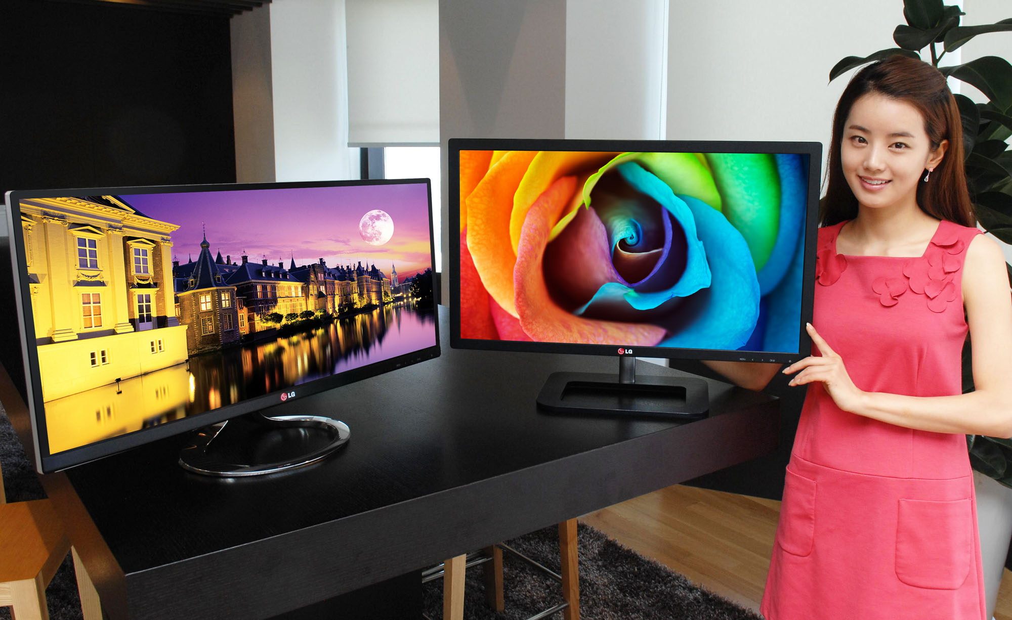 A model presents LG premium IPS monitors, E83 and E93