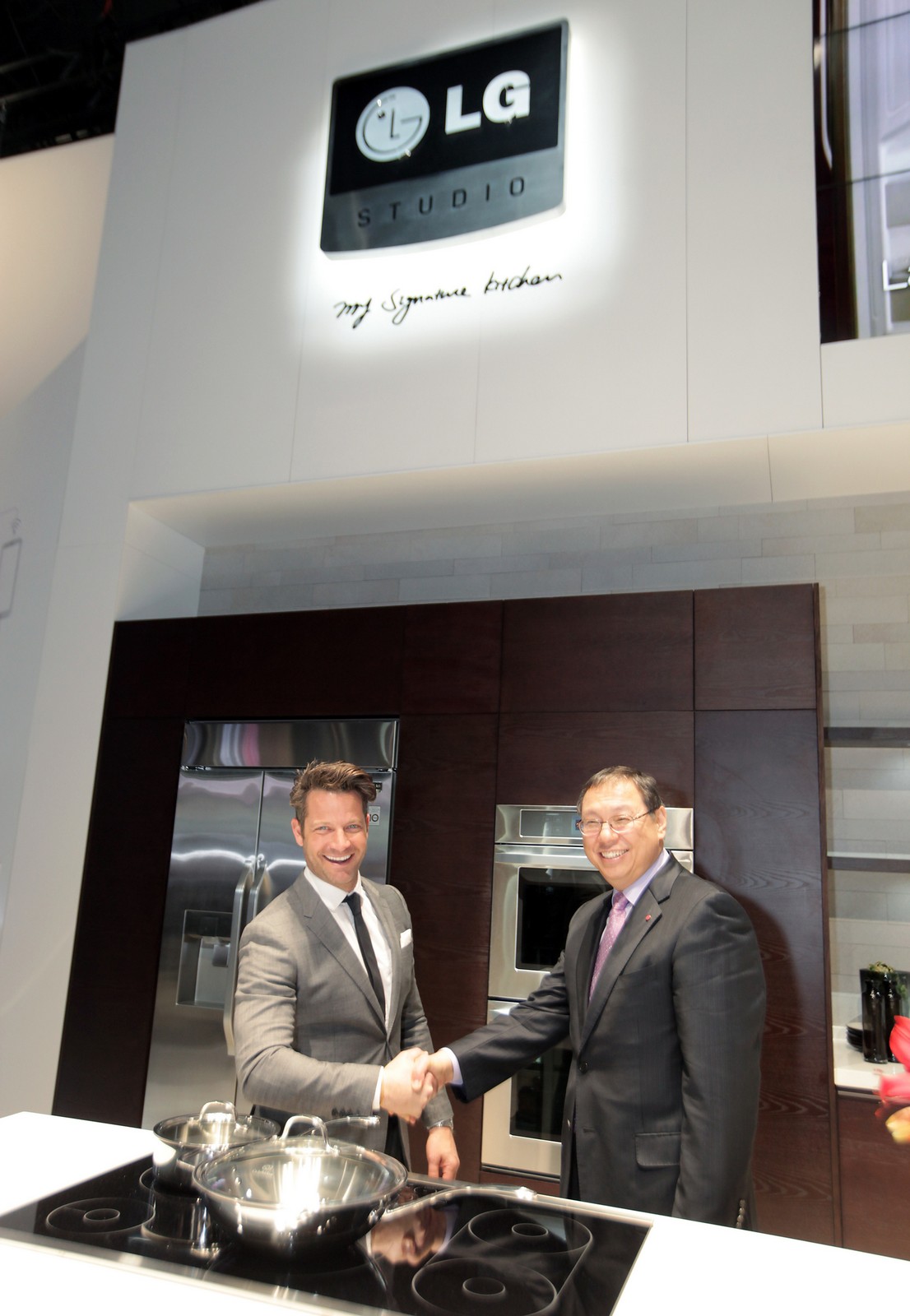 Nate and LG executive shaking their hands
