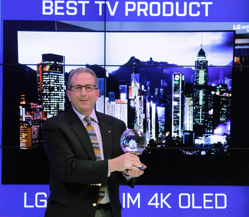 LG representative holds one of the awards earned at CES 2015.