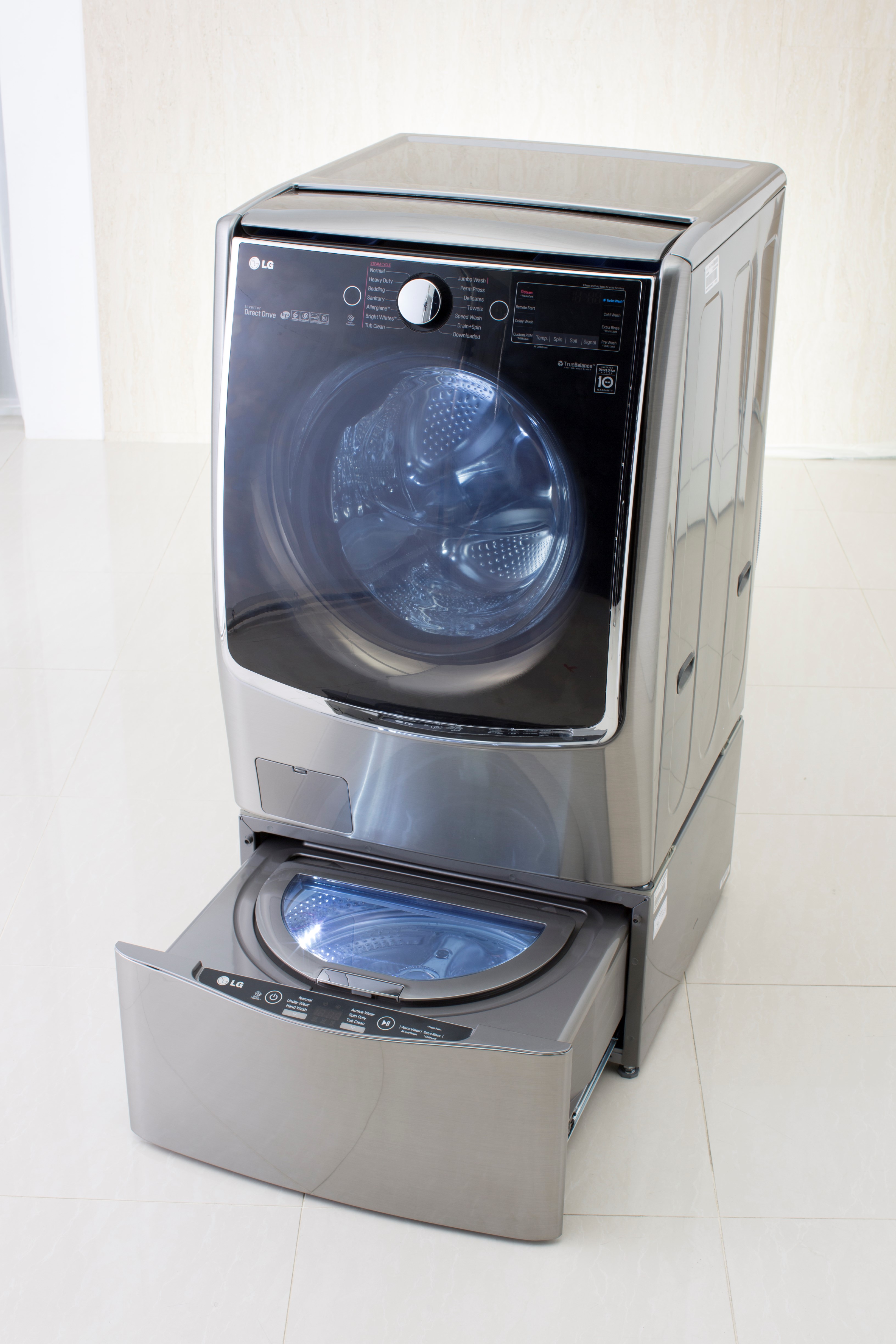 Right side view of LG TWINWash™ washing machine slightly facing left side with its Mini washer opened