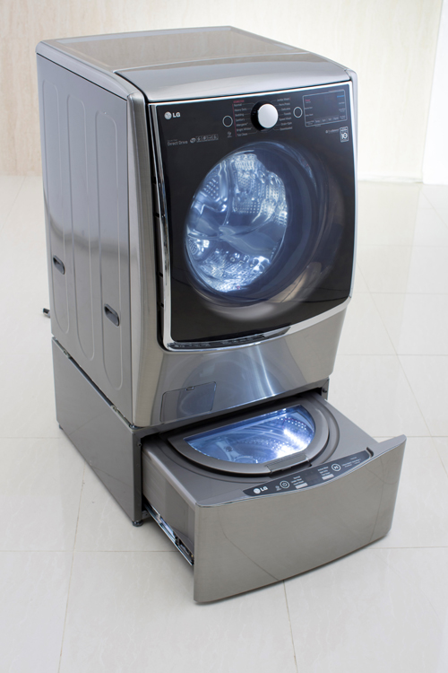 Left view of LG TWINWash™ washing machine with its Mini washer opened