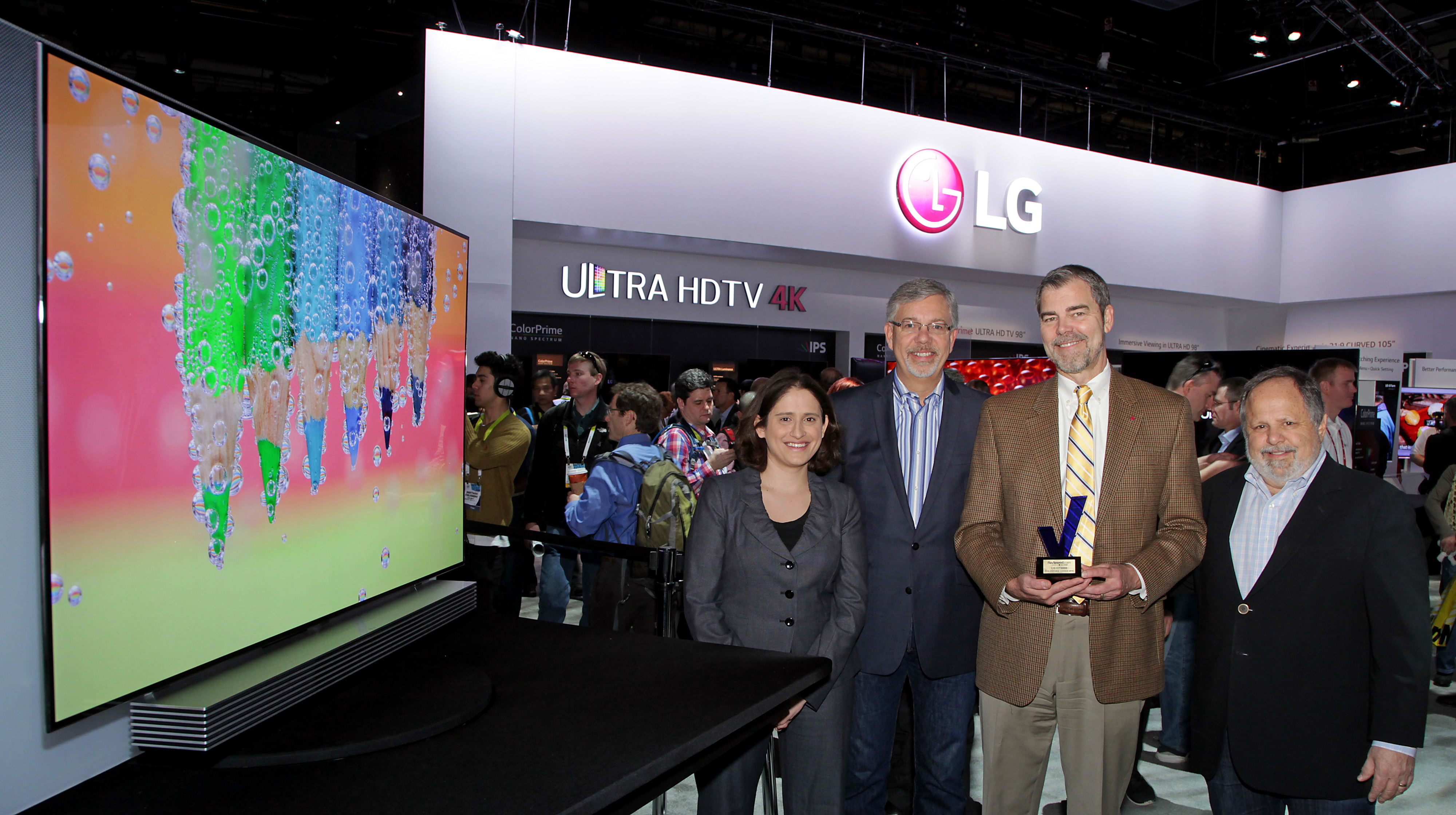 David VanderWaal, director of home appliance brand marketing, LG Electronics USA (third from left), holds one of the awards earned at CES 2015, and takes a group picture with colleagues
