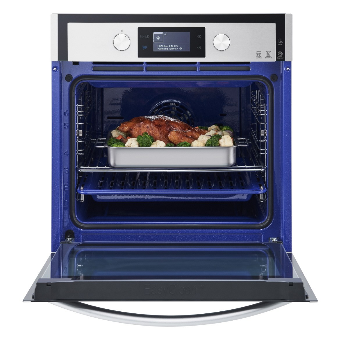 LG Studio oven with door opened and cooked food inside