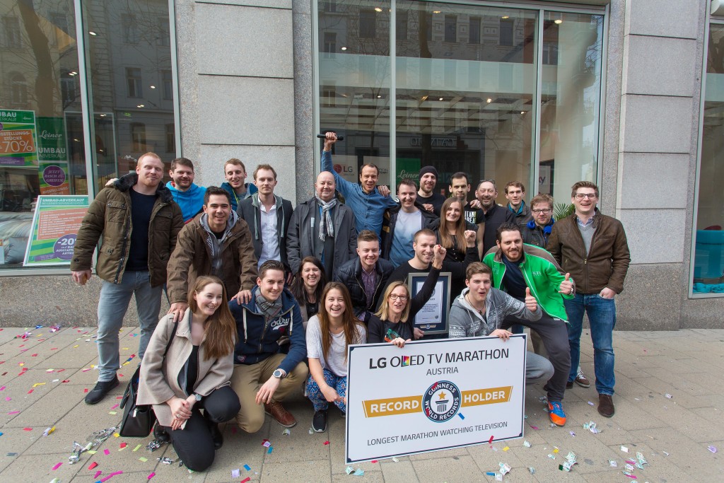 Five participants and their supporters pose for a photo with their new Guinness World Records certificate.