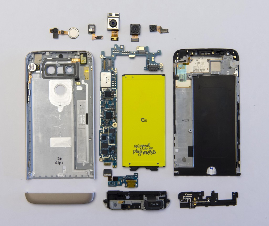 All modular components of LG G5 laid out on flat surface