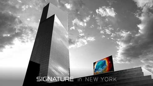 LG SIGNATURE OLED TV with Picture-on-Glass design next to the reflective glass of 4 World Trade Center building in New York