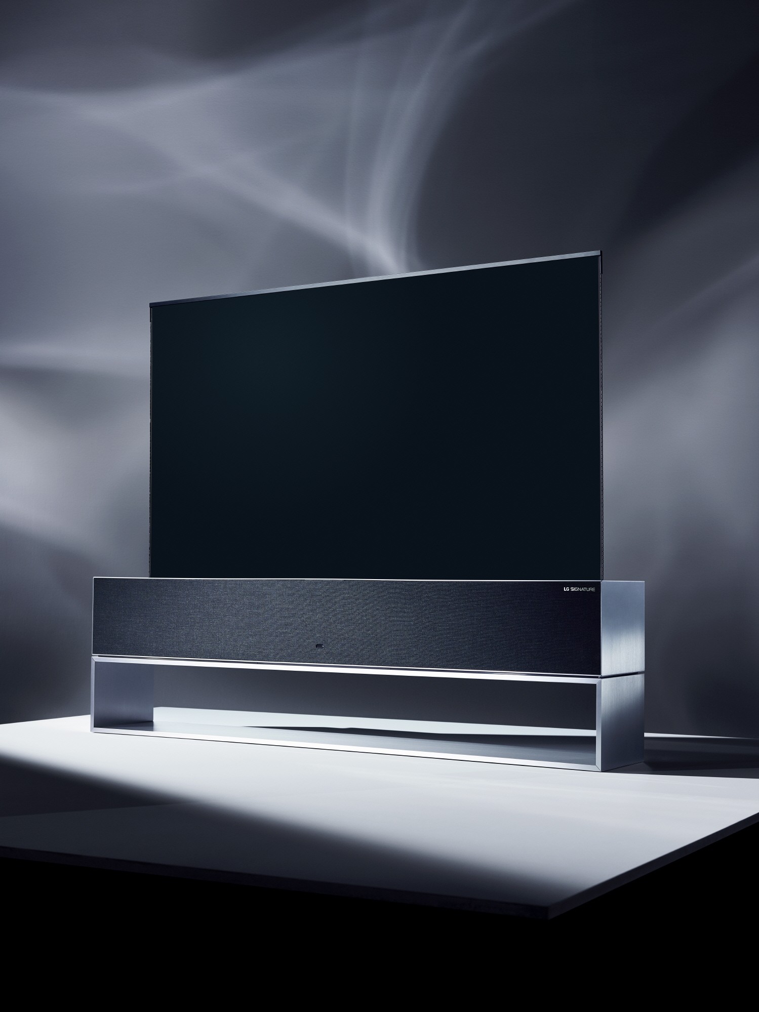 A right-side view of LG SIGNATURE OLED TV R model 65R9 on display