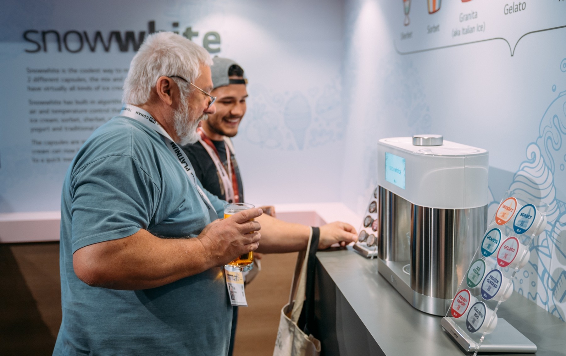Delegates take a demo of LG’s personal ice cream maker prototype, snowwhite.