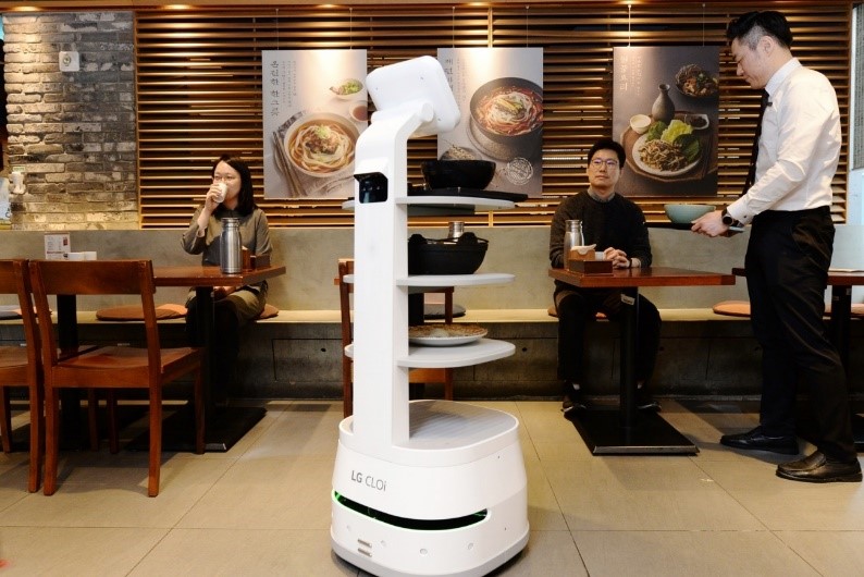 LG CLOi ServeBot safely delivering meals to customers to help minimize interactions between staff and diners