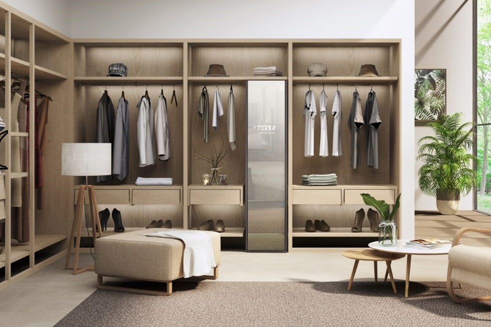 LG Styler effortlessly blending into a modern dressing room with smart clothes hanging up on either side